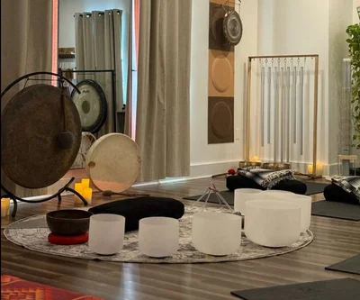 woman in black tank top and black pants doing yoga