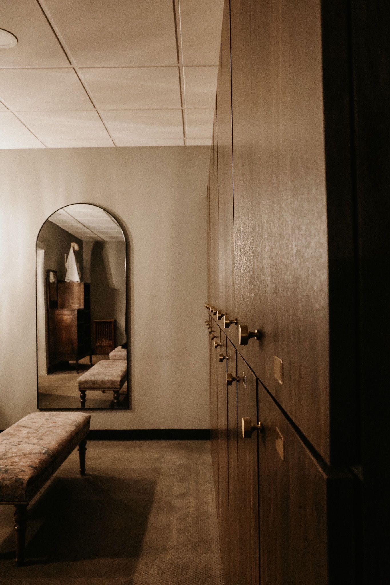 man placing weight plate on barbell