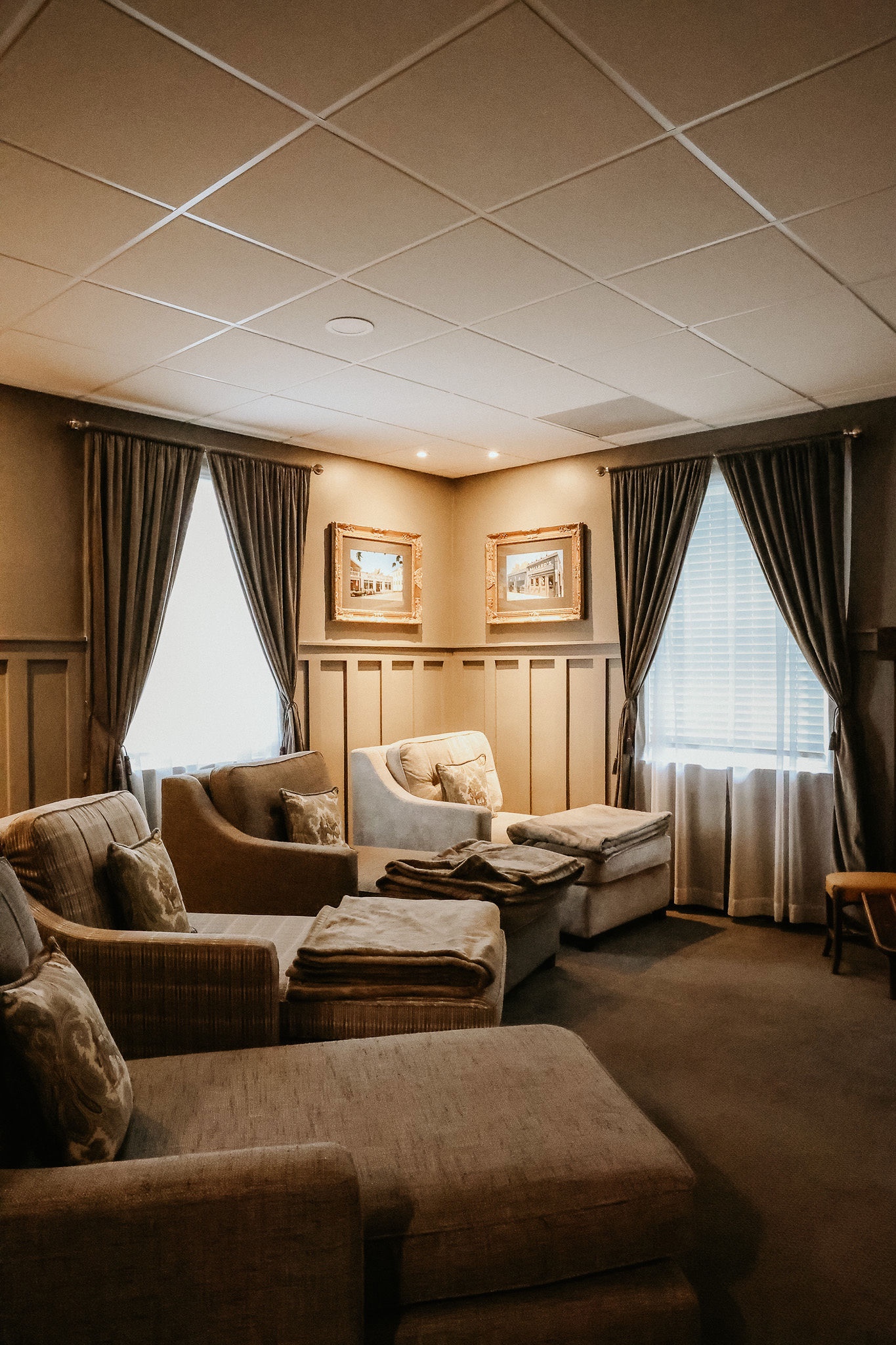people in a room with a black table and chairs