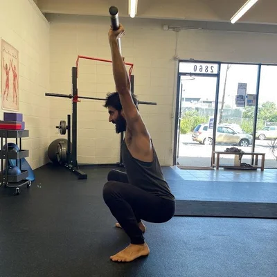 black metal kettle bell and heavy bag