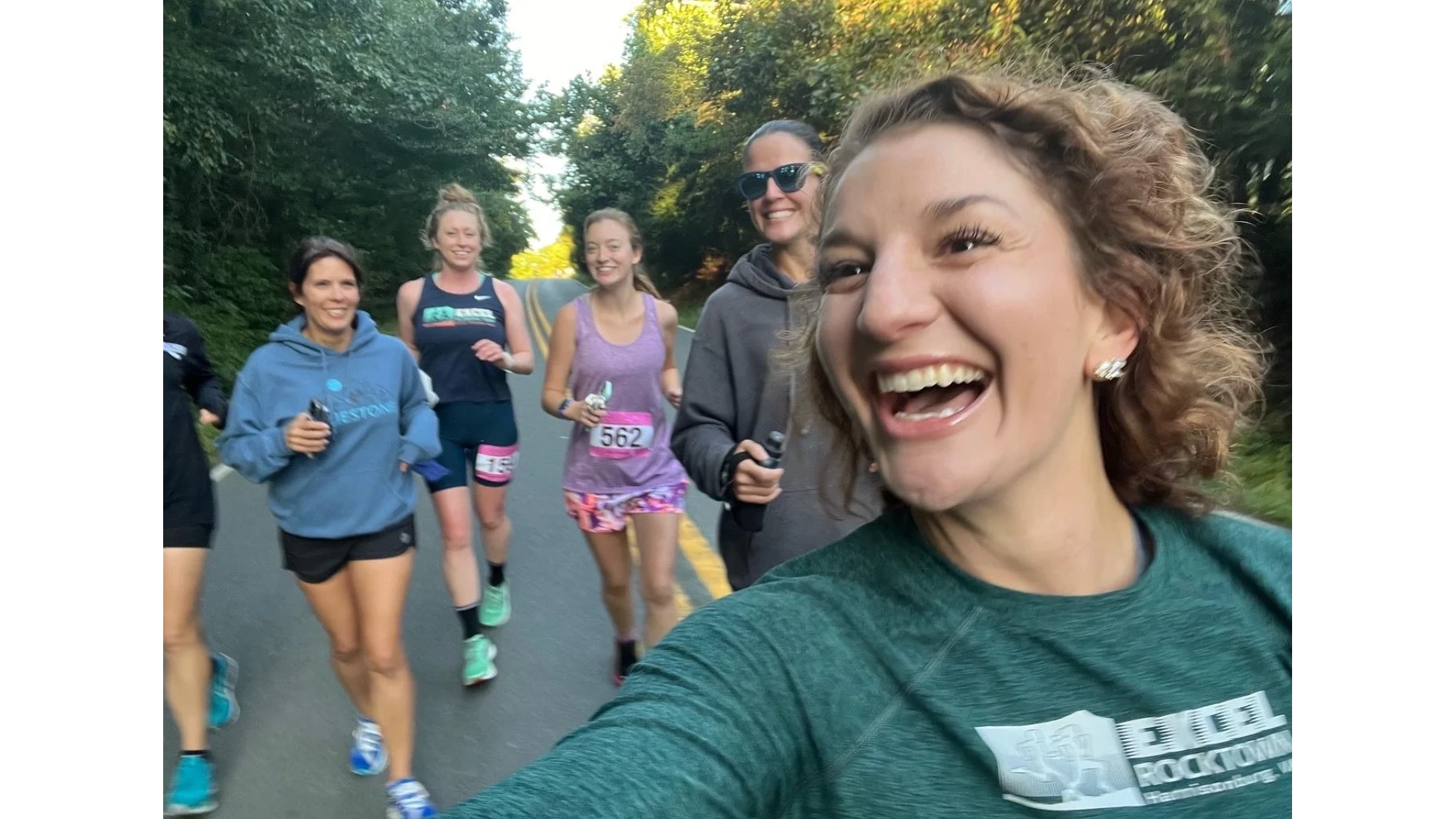 man placing weight plate on barbell