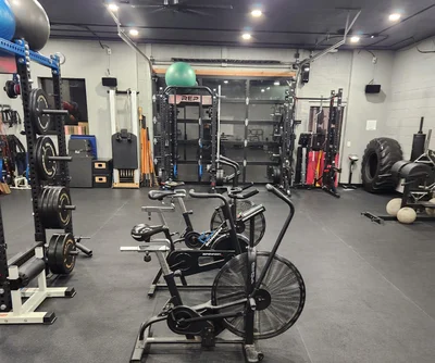 black metal kettle bell and heavy bag