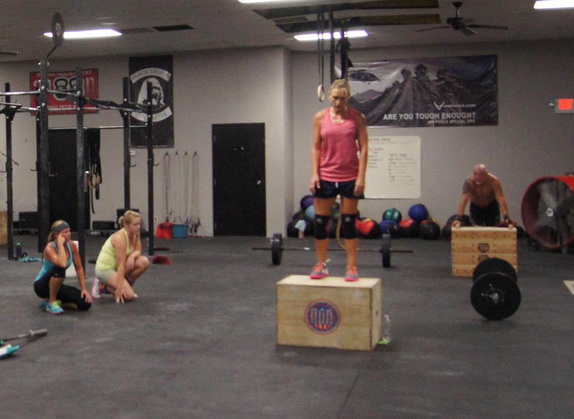 a gym with a barbell and weight plates