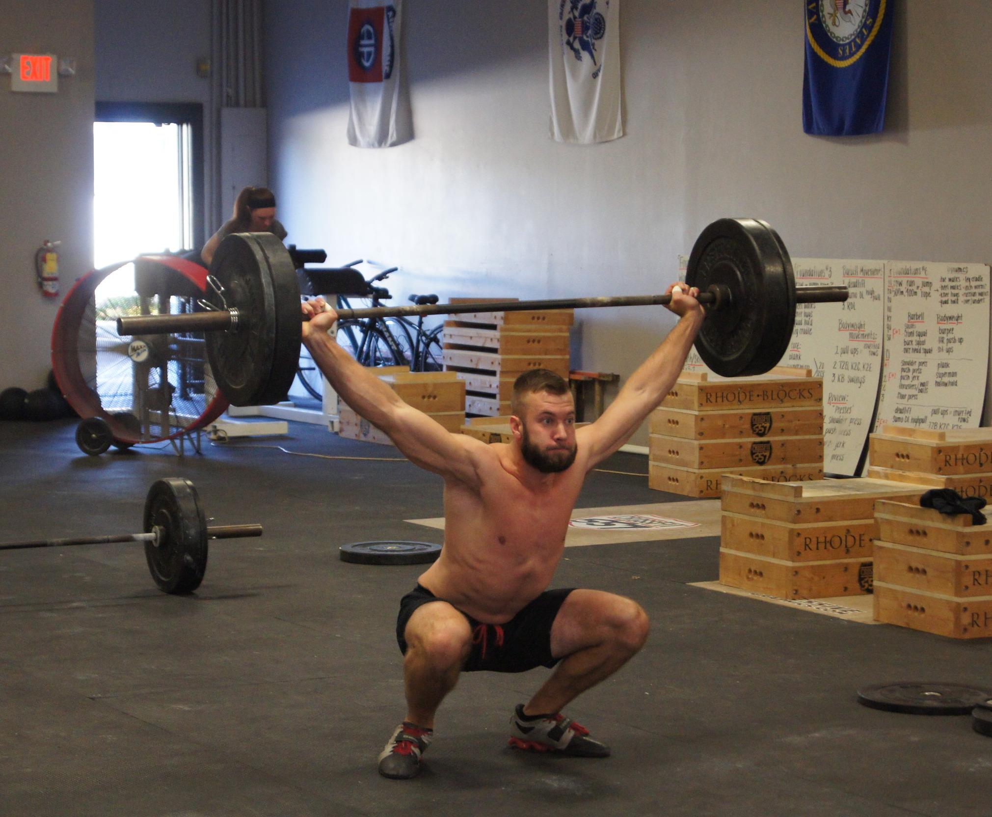 a gym with a barbell and weight plates