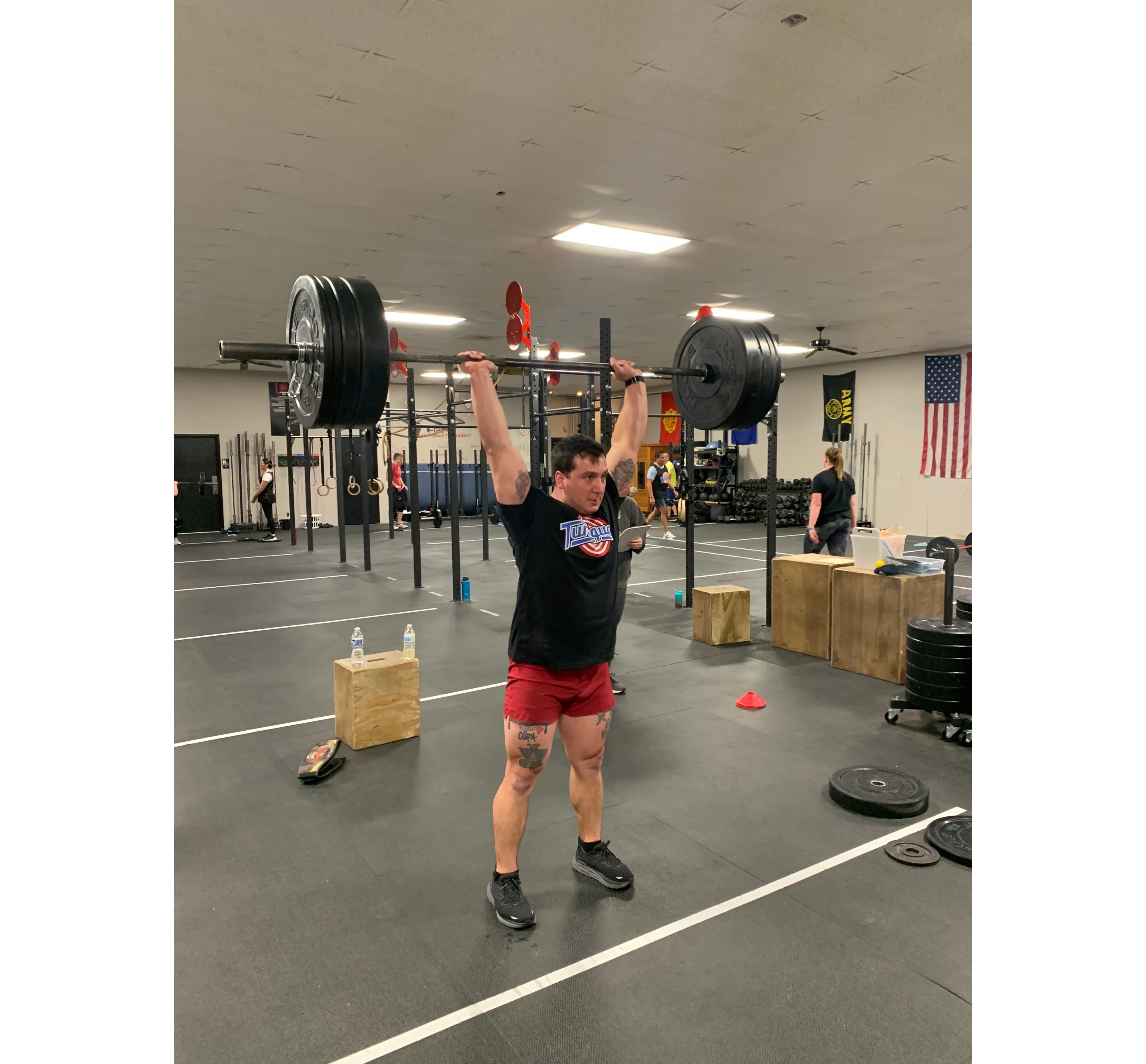 a gym with a barbell and weight plates
