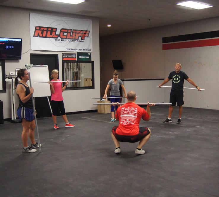 a gym with a barbell and weight plates