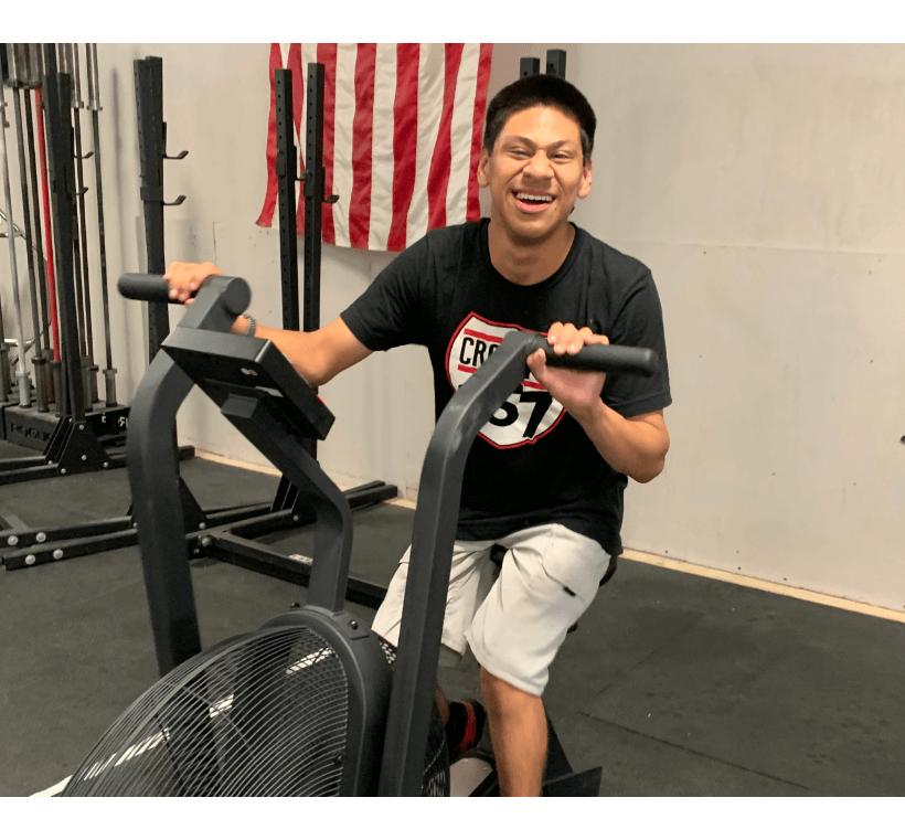 a gym with a barbell and weight plates