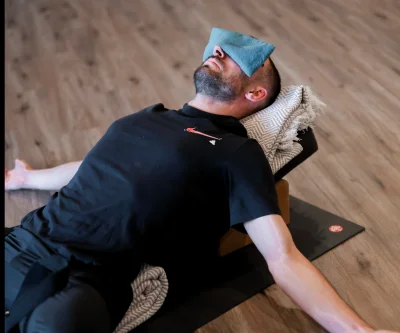 man placing weight plate on barbell