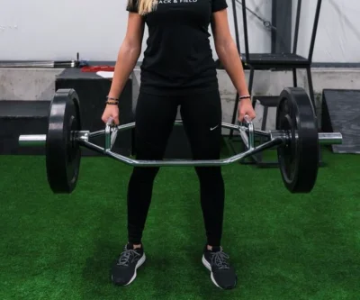 woman carrying barbells
