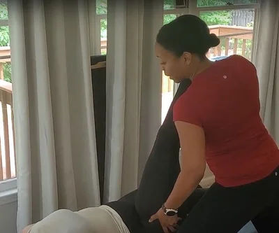 a person standing on a yoga mat on the floor