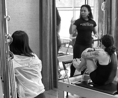 a person standing on a yoga mat on the floor