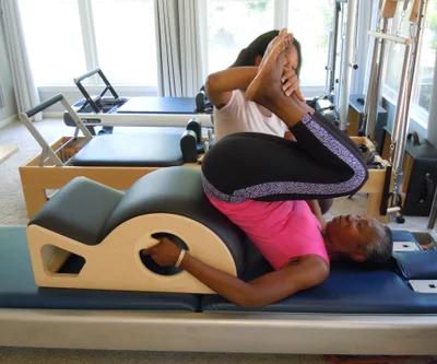 pink dumbbell on pink textile